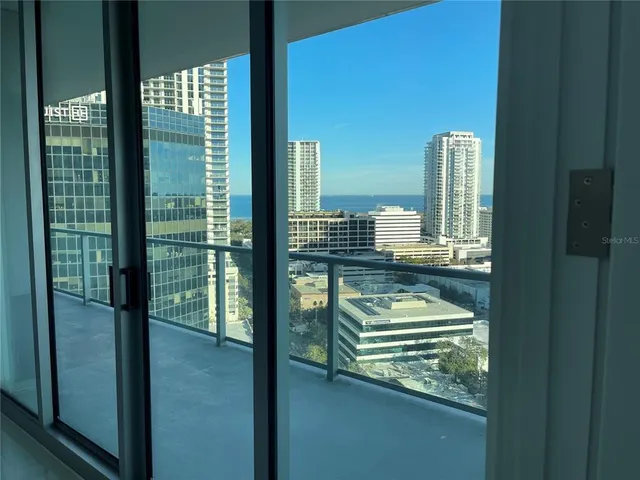 a room view with a floor to ceiling window