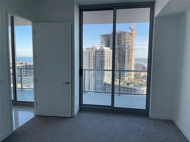 a view of an empty room with a window