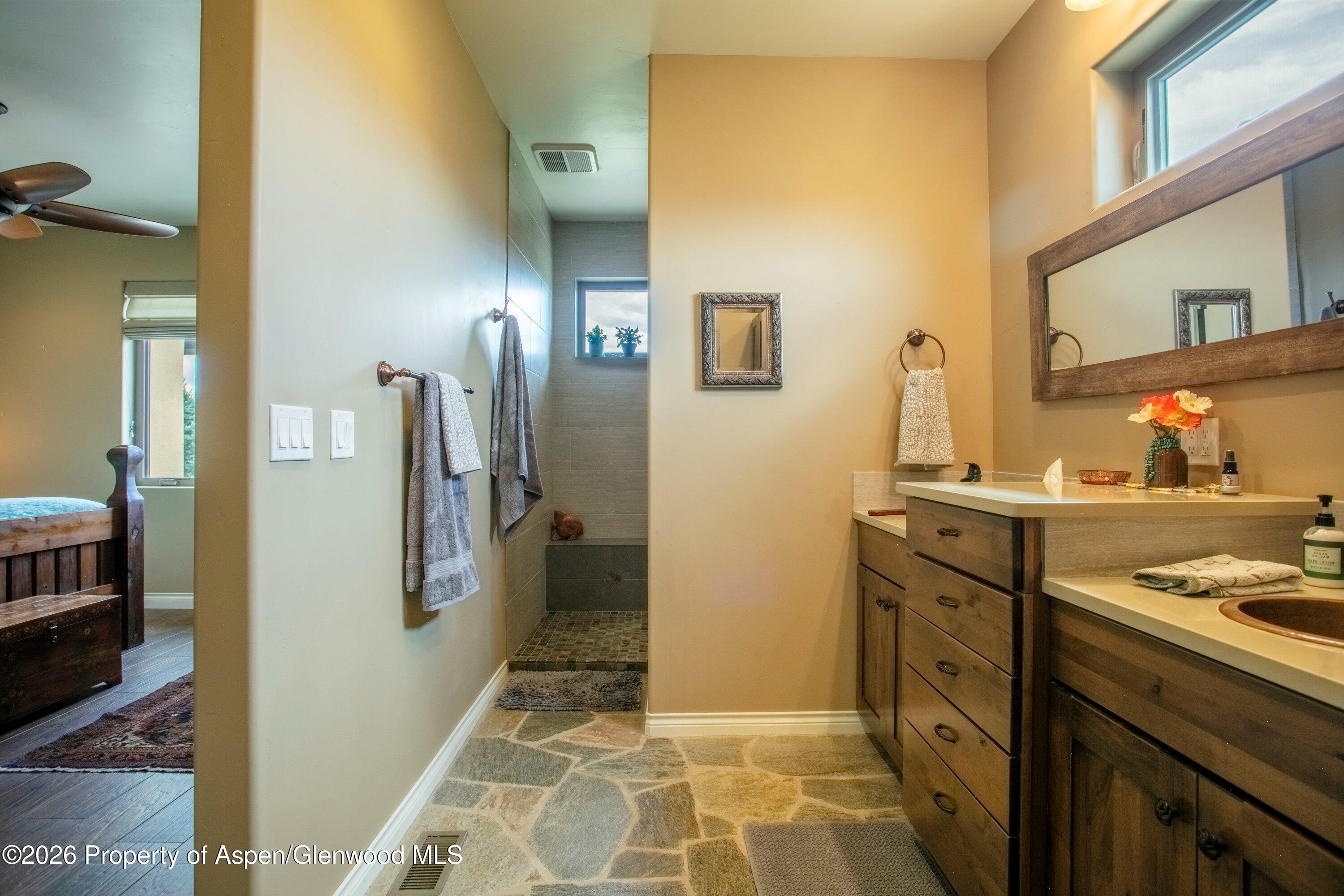 265 South Meadow Drive Rifle, CO 81650 - Photo 56 of 76 a bathroom with a sink and a mirror