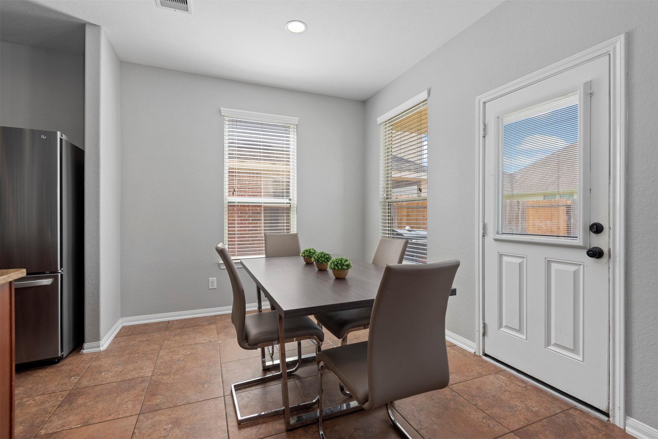 6211 Flagg Ranch Drive Spring, TX 77388 - Photo 15 of 36 Bright breakfast area with natural light and direct access to the backyard. Ideal for everyday meals with a cozy and inviting feel.