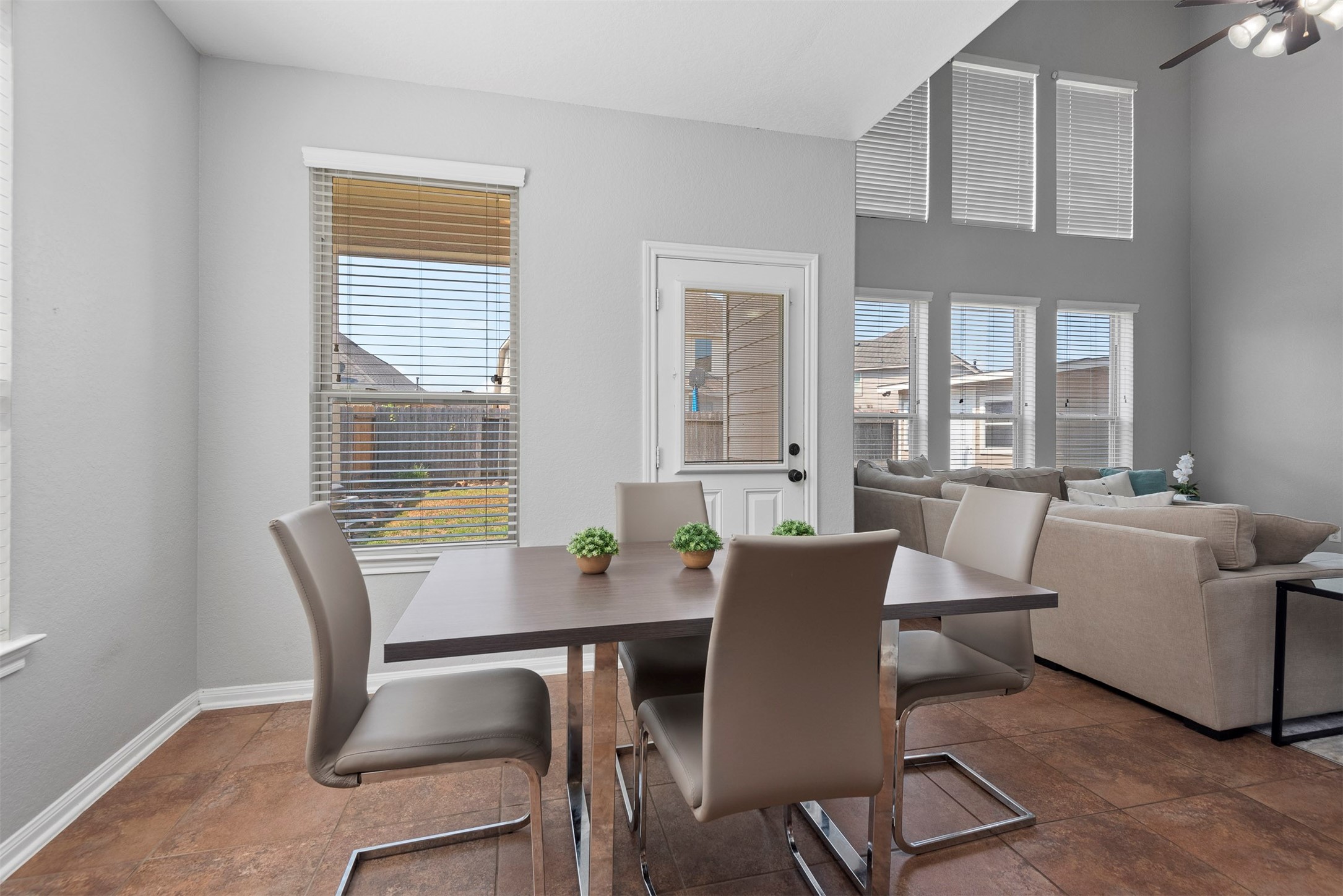 6211 Flagg Ranch Drive Spring, TX 77388 - Photo 16 of 36 Open dining space flows effortlessly into the living area, creating a connected and airy layout. Large windows bring in abundant natural light throughout.
