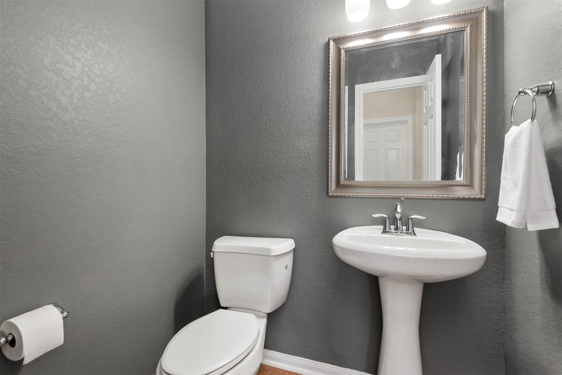 6211 Flagg Ranch Drive Spring, TX 77388 - Photo 22 of 36 Conveniently located half bath on the first floor between the living area and primary bedroom, perfect for guests.