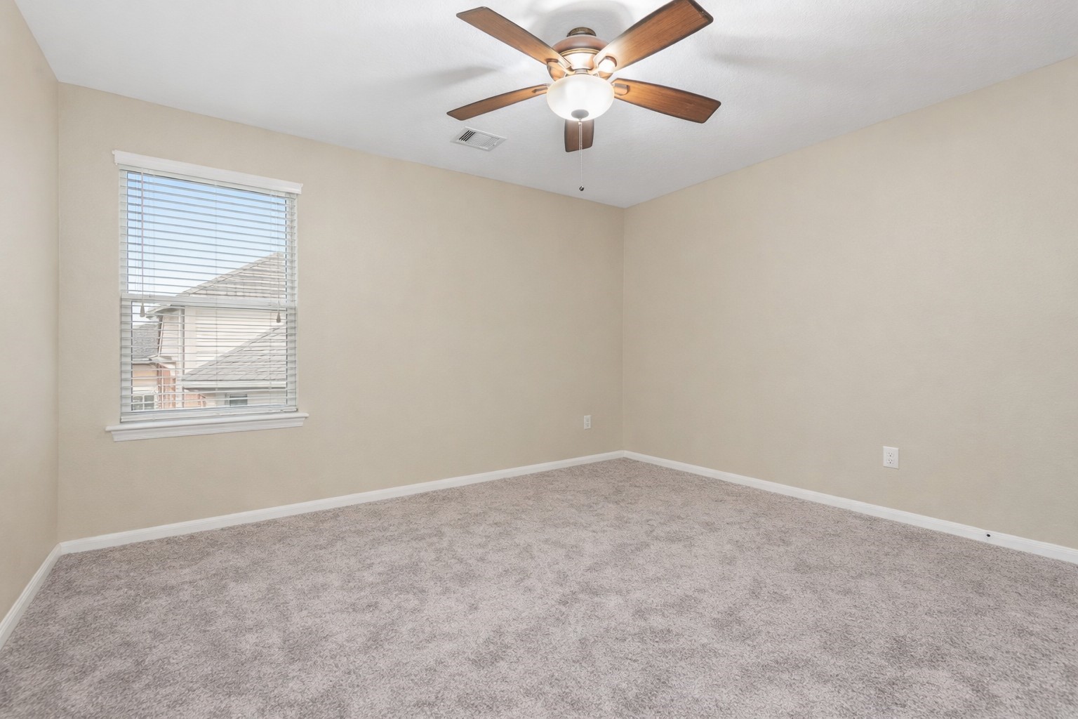 6211 Flagg Ranch Drive Spring, TX 77388 - Photo 27 of 36 Secondary bedroom featuring soft carpet, neutral paint, and a large window that brings in plenty of natural light.