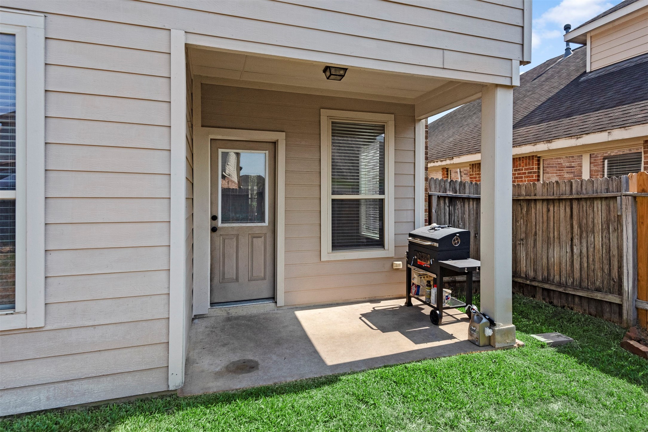 6211 Flagg Ranch Drive Spring, TX 77388 - Photo 34 of 36 Covered patio area perfect for outdoor seating, grilling, and relaxing year-round.
