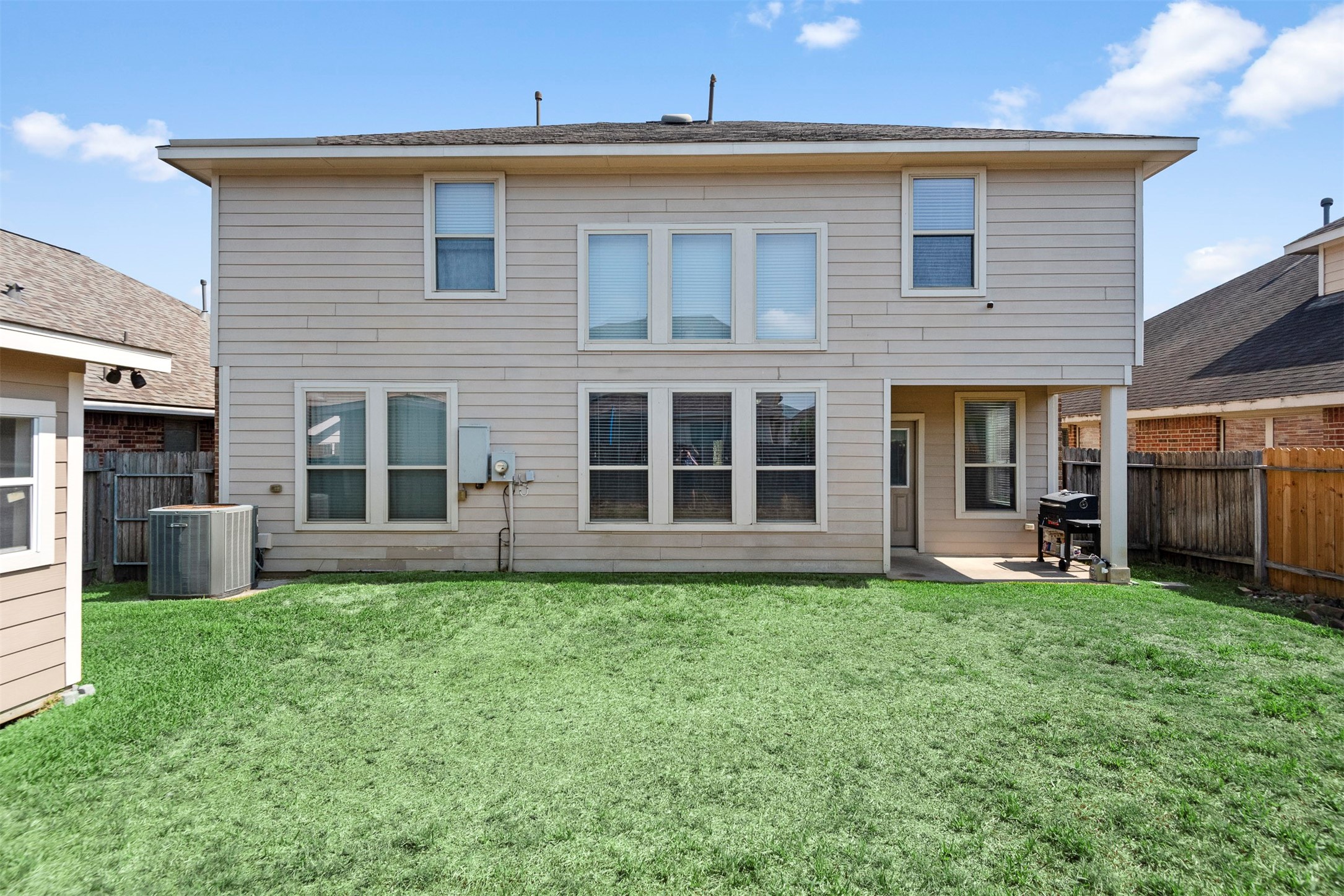 6211 Flagg Ranch Drive Spring, TX 77388 - Photo 36 of 36 Full rear view of the home showcasing multiple windows for natural light and a large backyard with plenty of usable space.