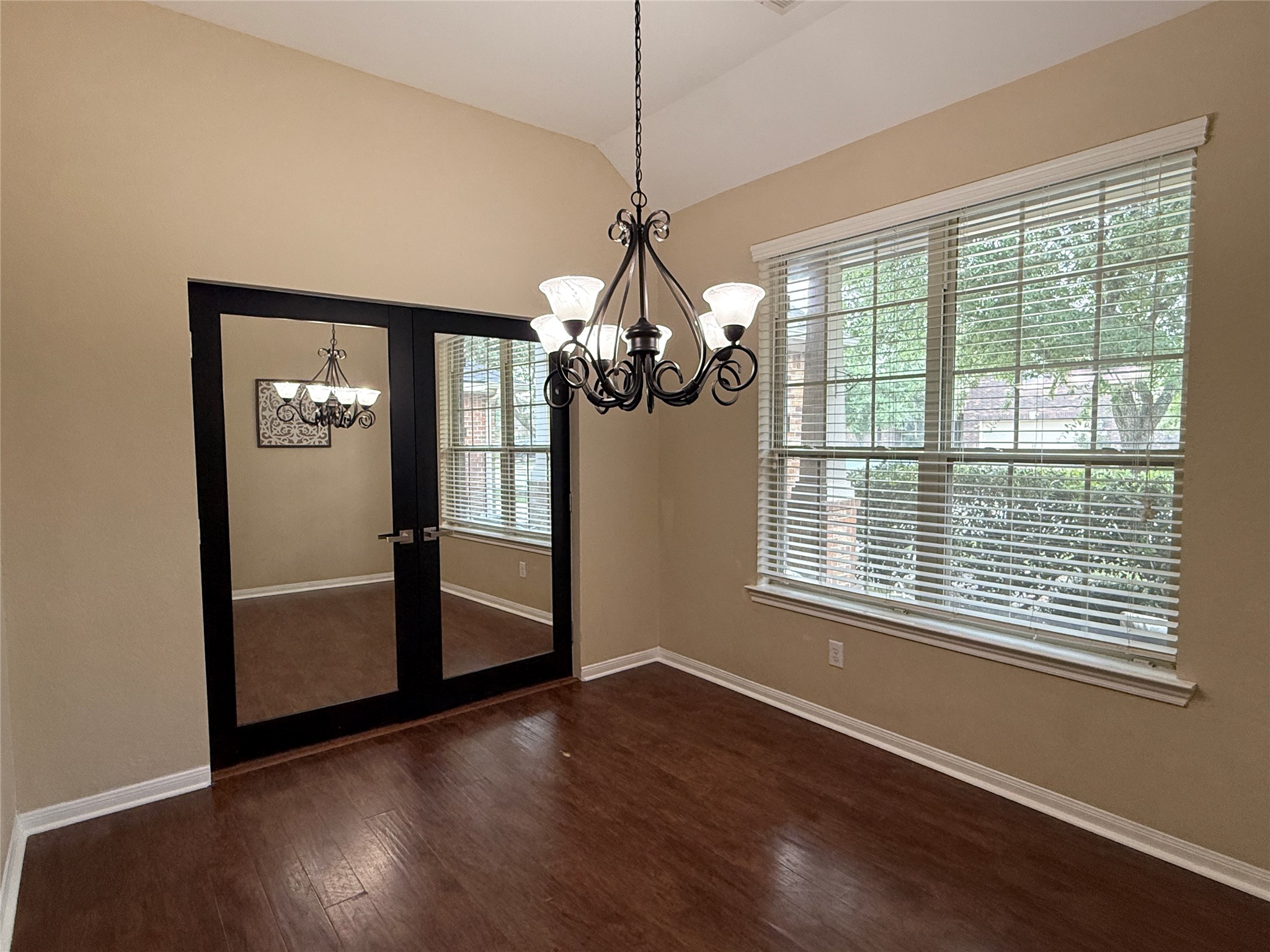 6211 Flagg Ranch Drive Spring, TX 77388 - Photo 8 of 36 Versatile office or flex space featuring rich wood flooring, abundant natural light, and reflective glass french doors.
