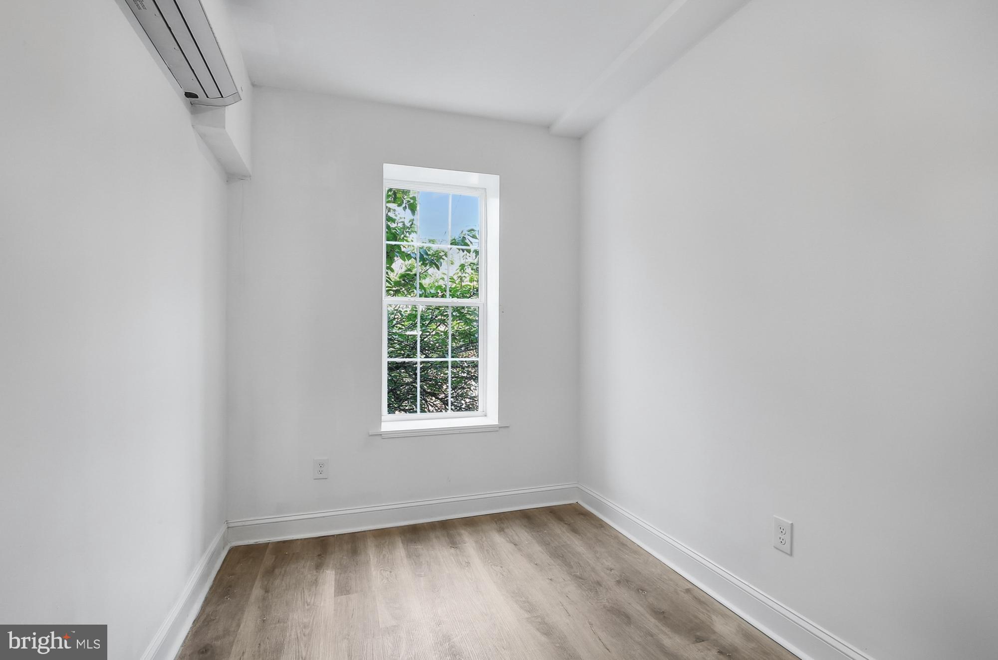 2046 East Huntingdon Street, Unit 2F Philadelphia, PA 19125 - Photo 11 of 15 an empty room with a window
