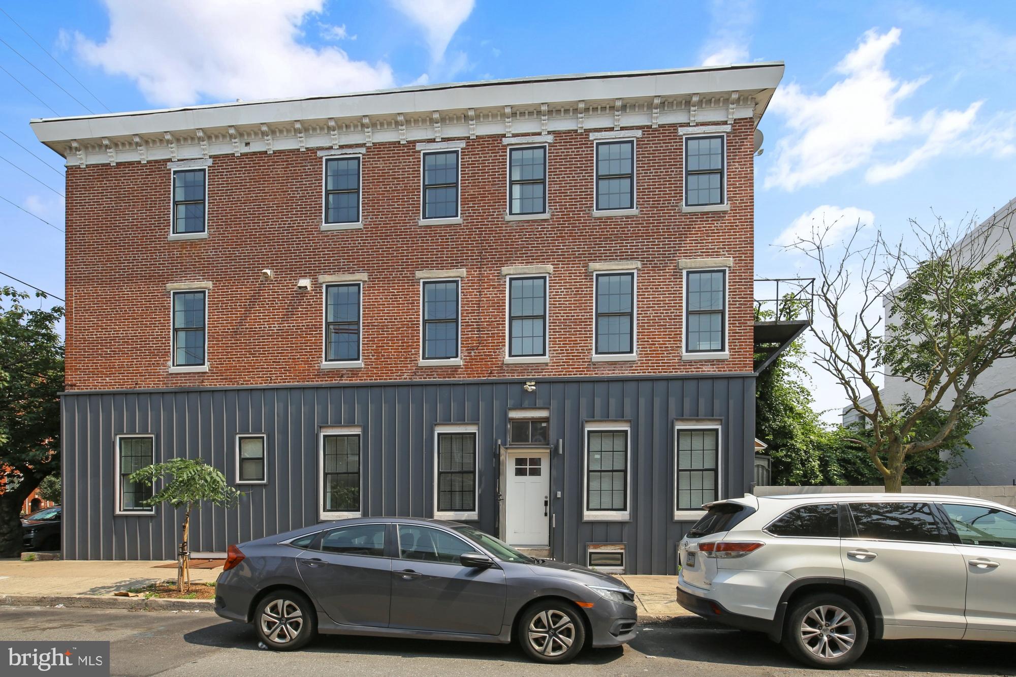 2046 East Huntingdon Street, Unit 2F Philadelphia, PA 19125 - Photo 13 of 15 a car parked in front of a building