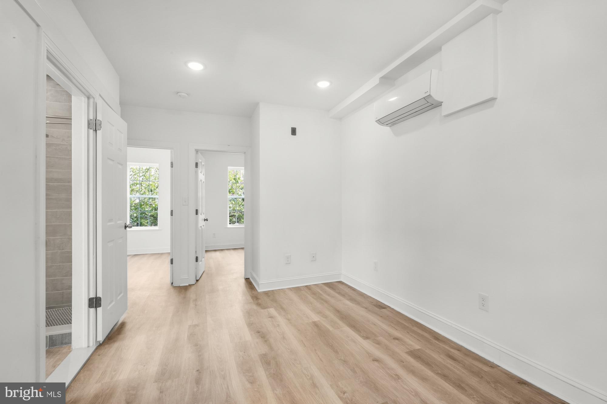 2046 East Huntingdon Street, Unit 2F Philadelphia, PA 19125 - Photo 3 of 15 a view of a big room with wooden floor and windows