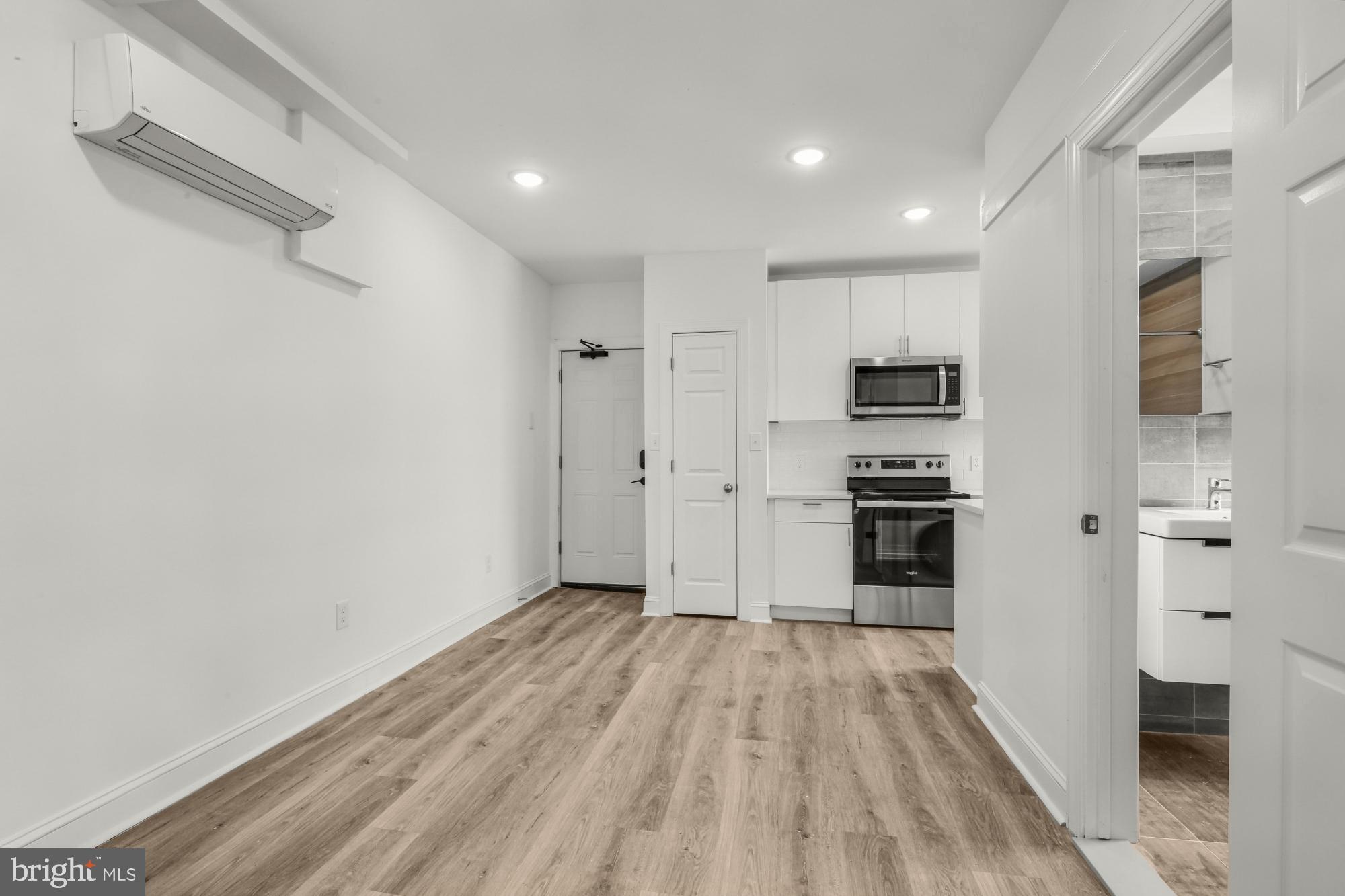 2046 East Huntingdon Street, Unit 2F Philadelphia, PA 19125 - Photo 5 of 15 a view of a kitchen with a refrigerator and cabinets
