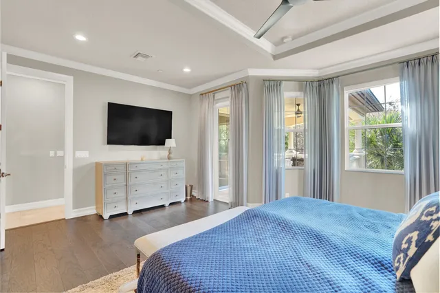 a bedroom with furniture and flat screen tv