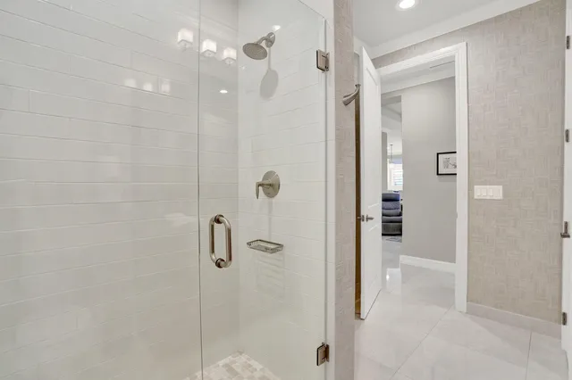 a roof deck with table and chairs and potted plants