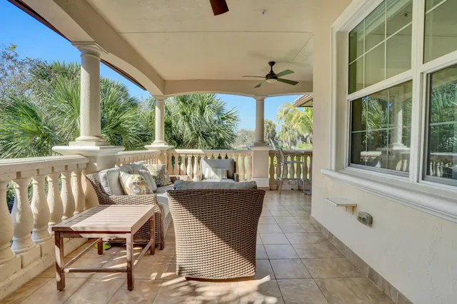 a view of an chairs and table in the balcony