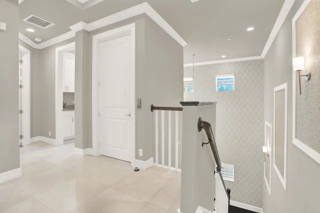 an aerial view of a houses with outdoor space and city view