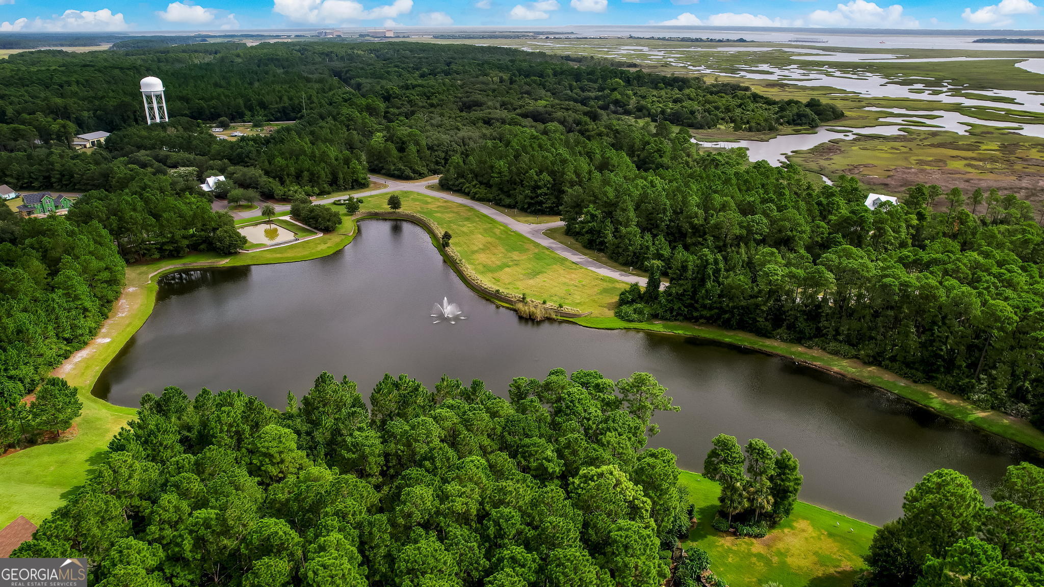 406 South Point Boulevard St. Marys, GA 31558 - Photo 12 of 15 an aerial view of a house with a yard and lake view