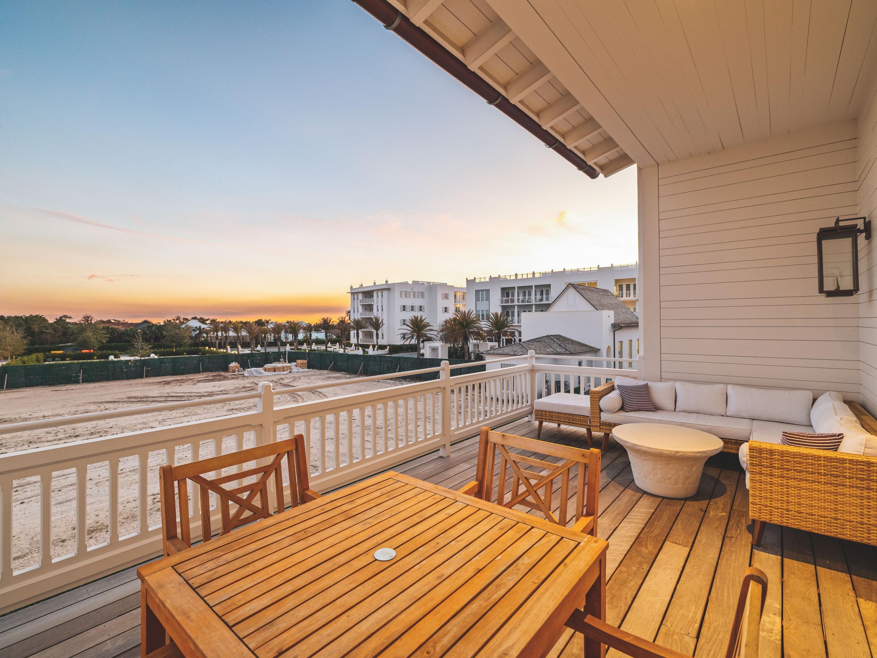 19 Astra Way Inlet Beach, Unit 11 Inlet Beach, FL 32461 - Photo 34 of 42 a view of a balcony with two chairs and a table