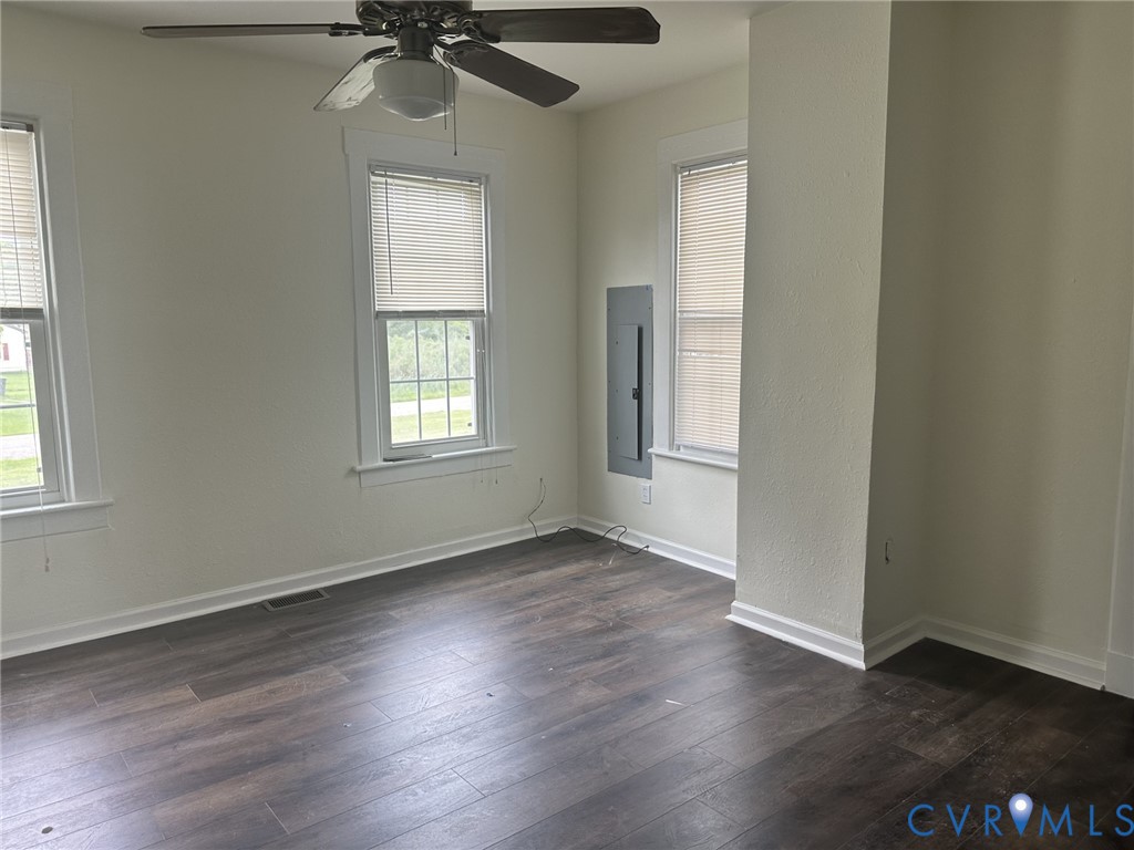 803 Beach Road Hampton, VA 23664 - Photo 37 of 43 an empty room with wooden floor closet and windows