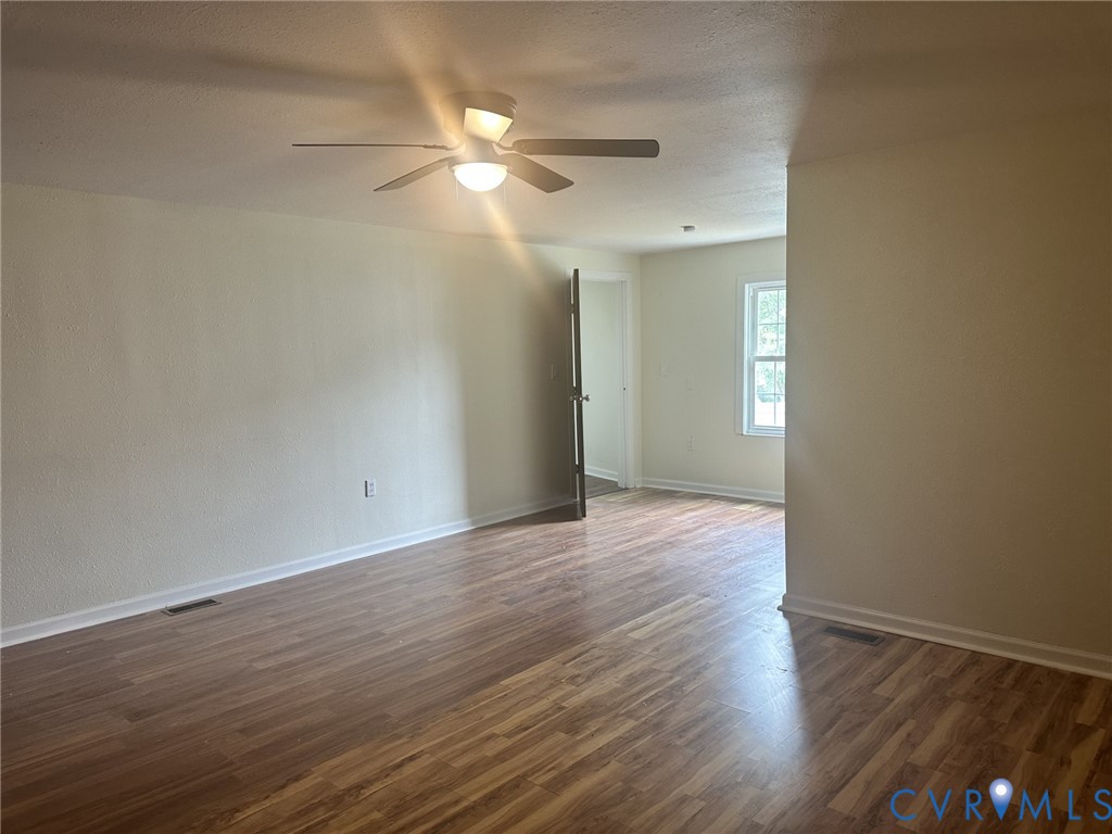 803 Beach Road Hampton, VA 23664 - Photo 42 of 43 a view of an empty room with wooden floor