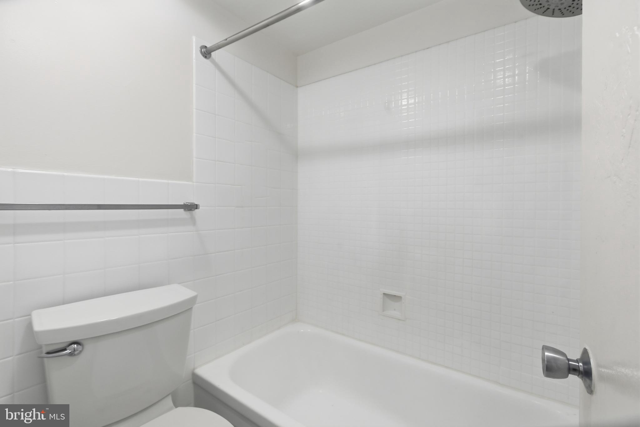 1440 Northwest N Street Northwest, Unit 404 Washington, DC 20005 - Photo 17 of 24 a bathroom with a toilet and bathtub