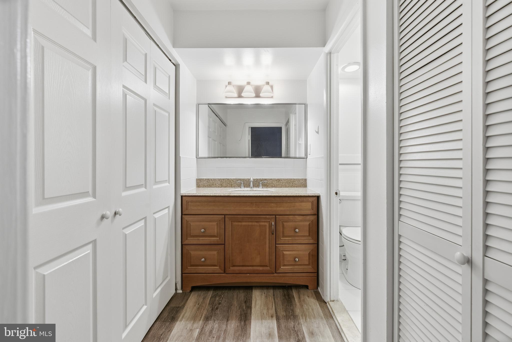 1440 Northwest N Street Northwest, Unit 404 Washington, DC 20005 - Photo 20 of 24 a bathroom with a sink and a mirror