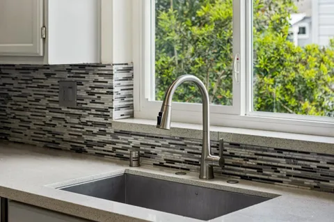a kitchen with a sink and a stove
