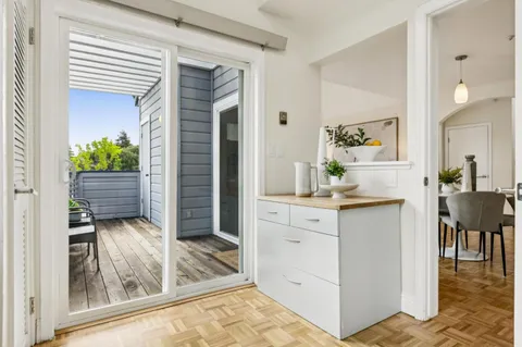 a view of kitchen with cabinets and outdoor space