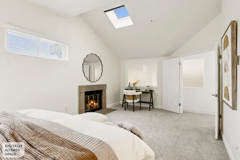 a bedroom with a bed and a lamp
