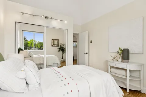 a bedroom with a bed and closet