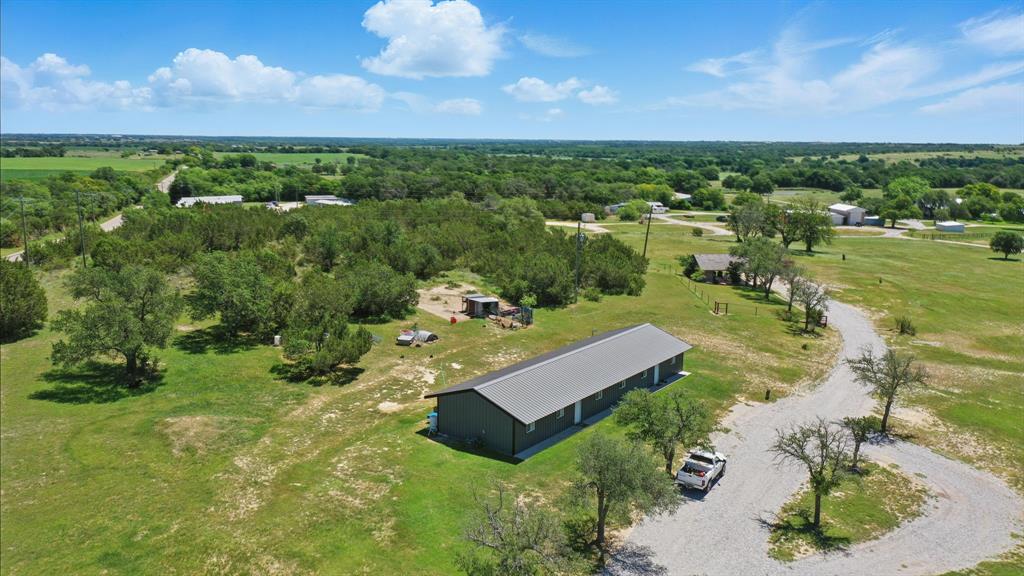 392 Tbd County Road Stephenville, TX 76401 - Photo 1 of 18 a view of a garden with a building in the background