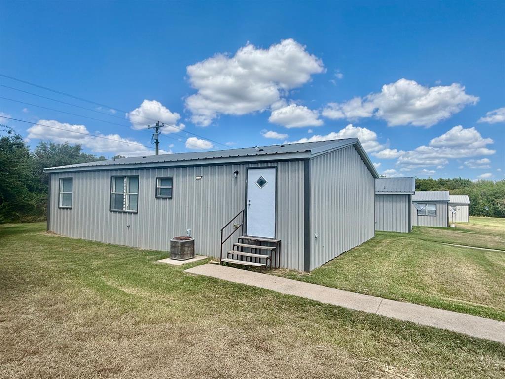 392 Tbd County Road Stephenville, TX 76401 - Photo 5 of 18 a view of a house with a backyard