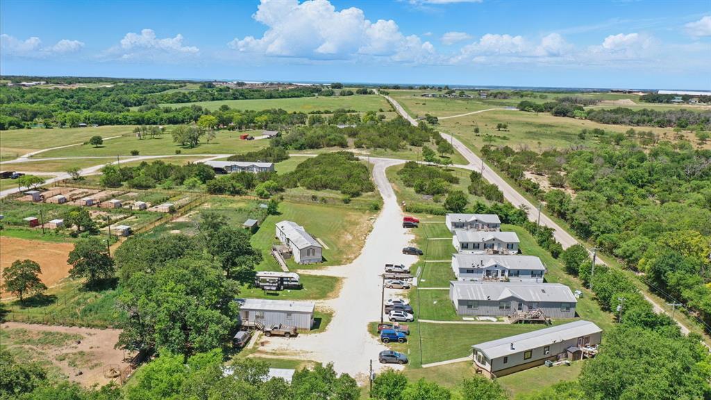 392 Tbd County Road Stephenville, TX 76401 - Photo 5 of 15 an aerial view of residential houses with outdoor space and a lake view