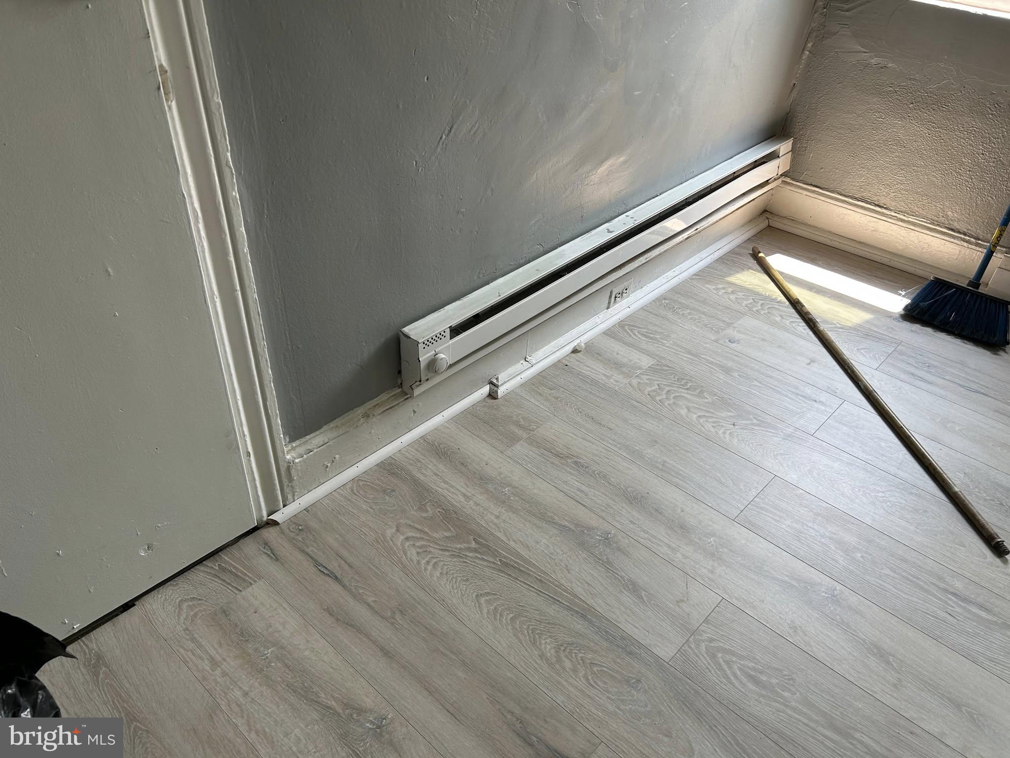 3612 North 5th Street Philadelphia, PA 19140 - Photo 3 of 9 a view of a hallway with wooden floor