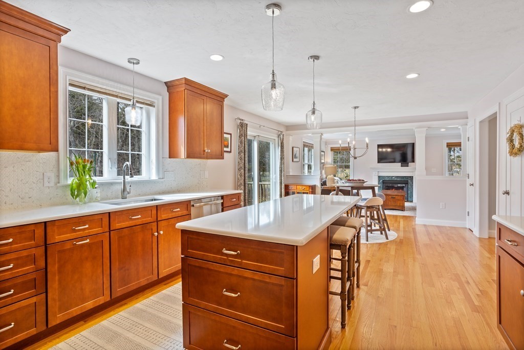 32 Harvard Road Bolton, MA 01740 - Photo 17 of 35 a view of a kitchen and dining table with chairs