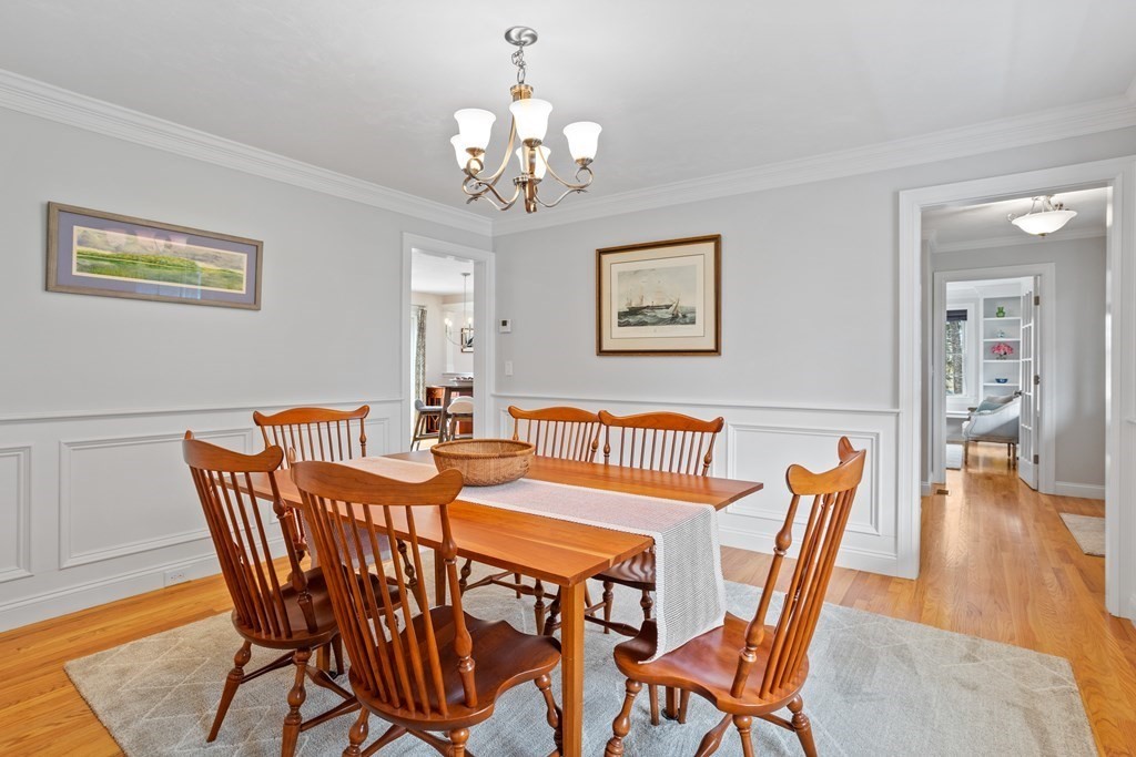 32 Harvard Road Bolton, MA 01740 - Photo 20 of 35 a view of a dining room with furniture wooden floor and a chandelier