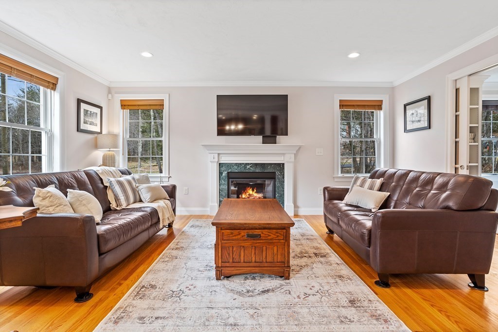 32 Harvard Road Bolton, MA 01740 - Photo 7 of 35 a living room with a couch and a window