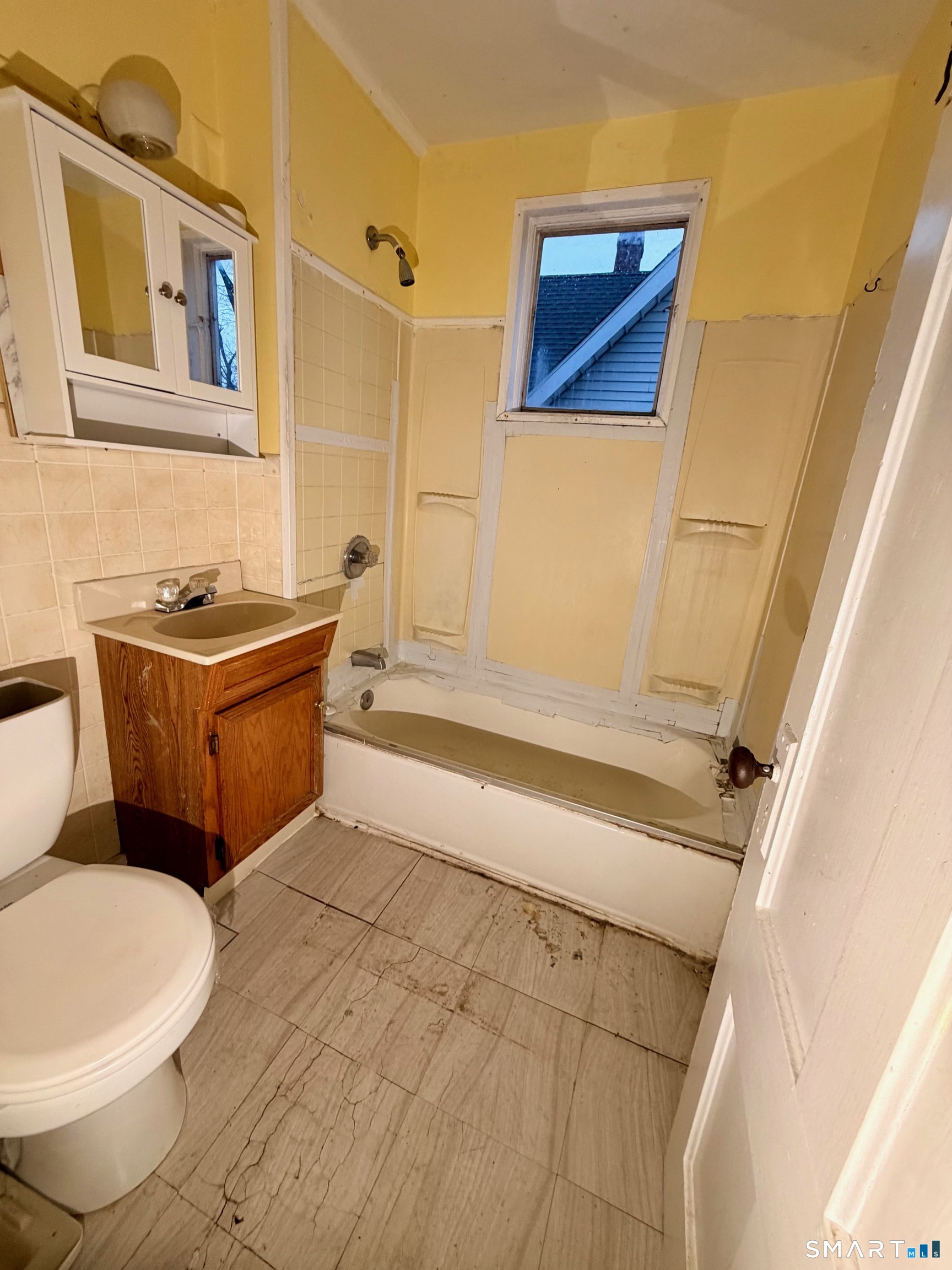 86 Linsley Avenue Meriden, CT 06451 - Photo 11 of 24 a bathroom with a toilet a sink and bathtub
