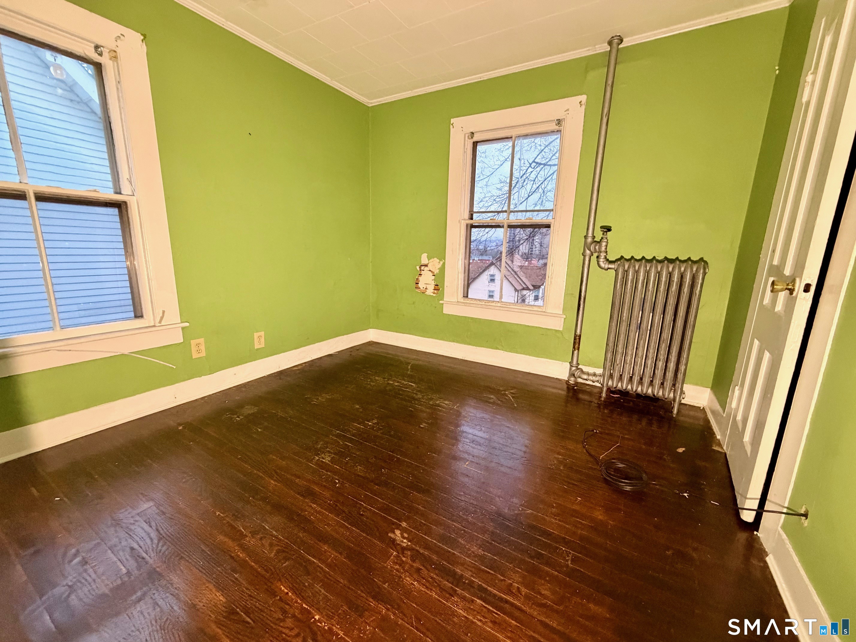 86 Linsley Avenue Meriden, CT 06451 - Photo 12 of 24 a view of an empty room with wooden floor and a window