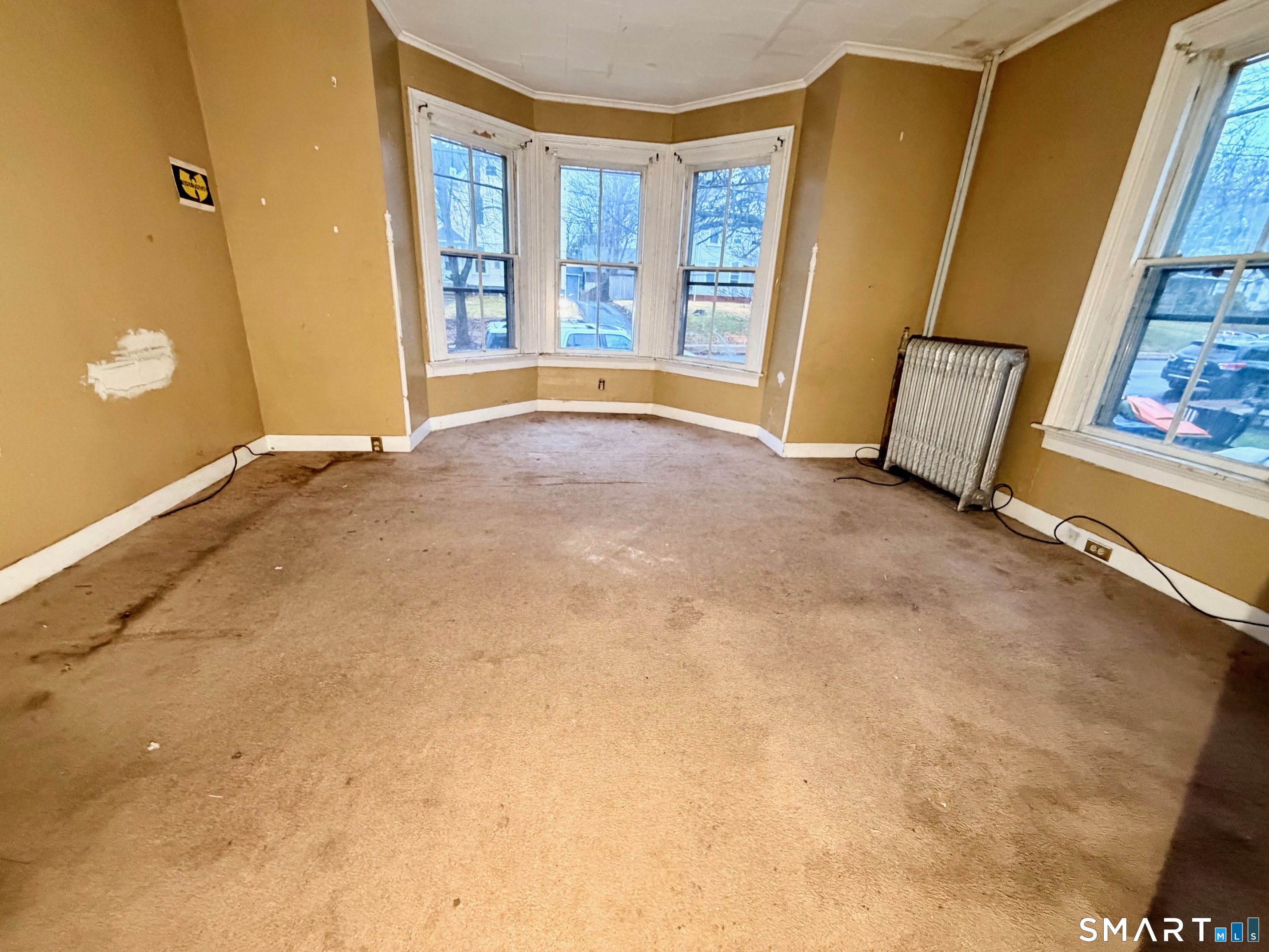 86 Linsley Avenue Meriden, CT 06451 - Photo 2 of 24 a view of an empty room with a window