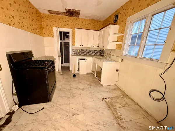 a living room with granite countertop furniture and a fireplace