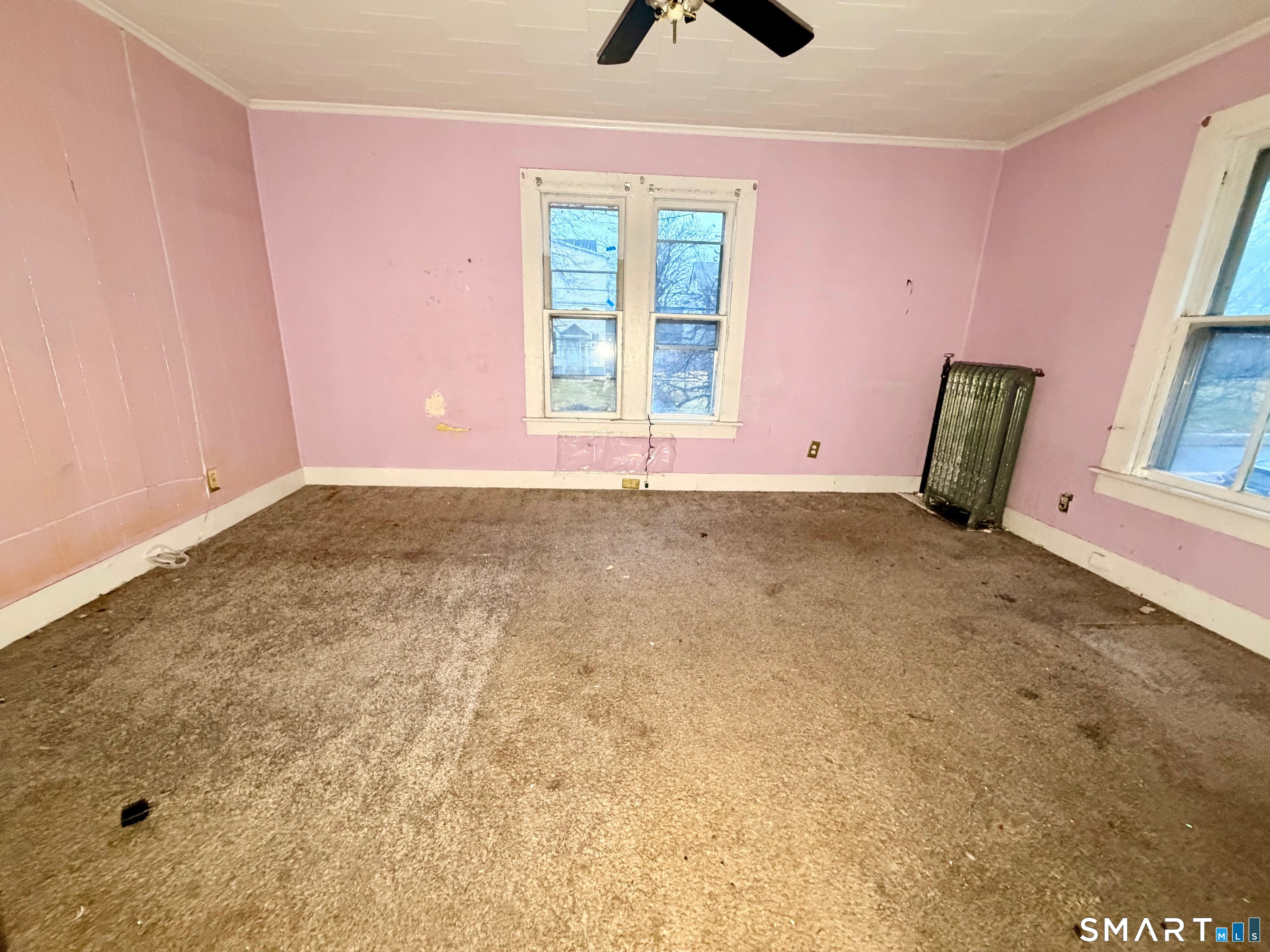 86 Linsley Avenue Meriden, CT 06451 - Photo 9 of 24 a view of an empty room with windows