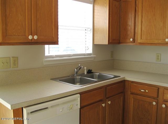 205-3 Long Bridge Road St. Johns, FL 32259 - Photo 8 of 30 a kitchen with a sink cabinets and a window