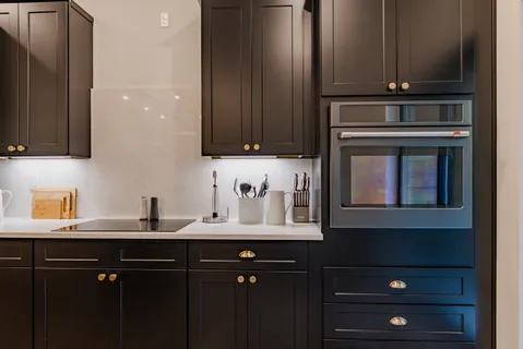 a kitchen with a sink and cabinets