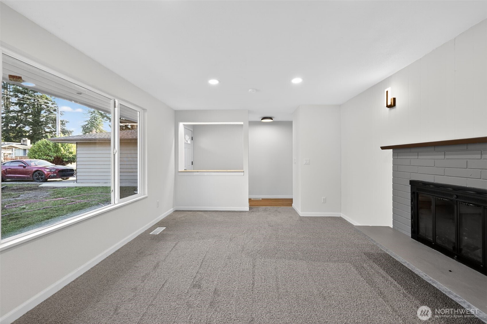17843 110th Avenue Southeast Renton, WA 98055 - Photo 13 of 31 a view of a livingroom with a fireplace and window