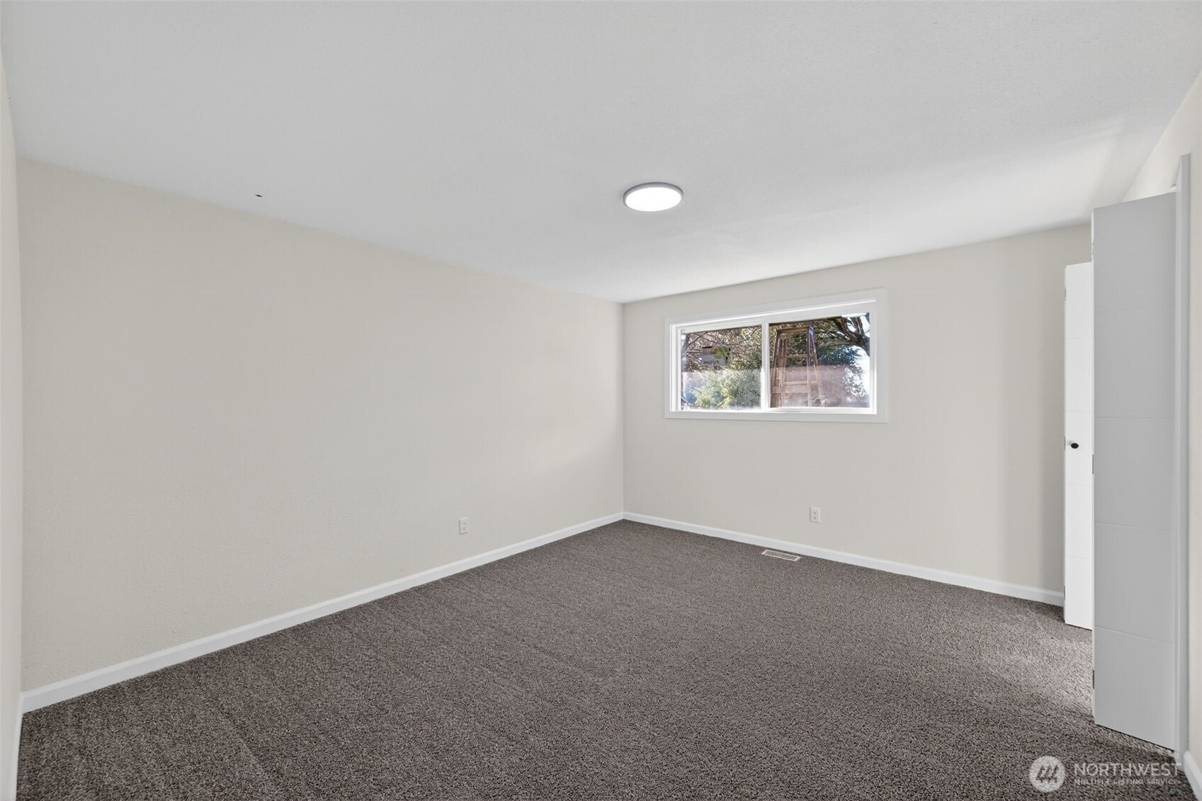 17843 110th Avenue Southeast Renton, WA 98055 - Photo 14 of 31 a view of an empty room with a window