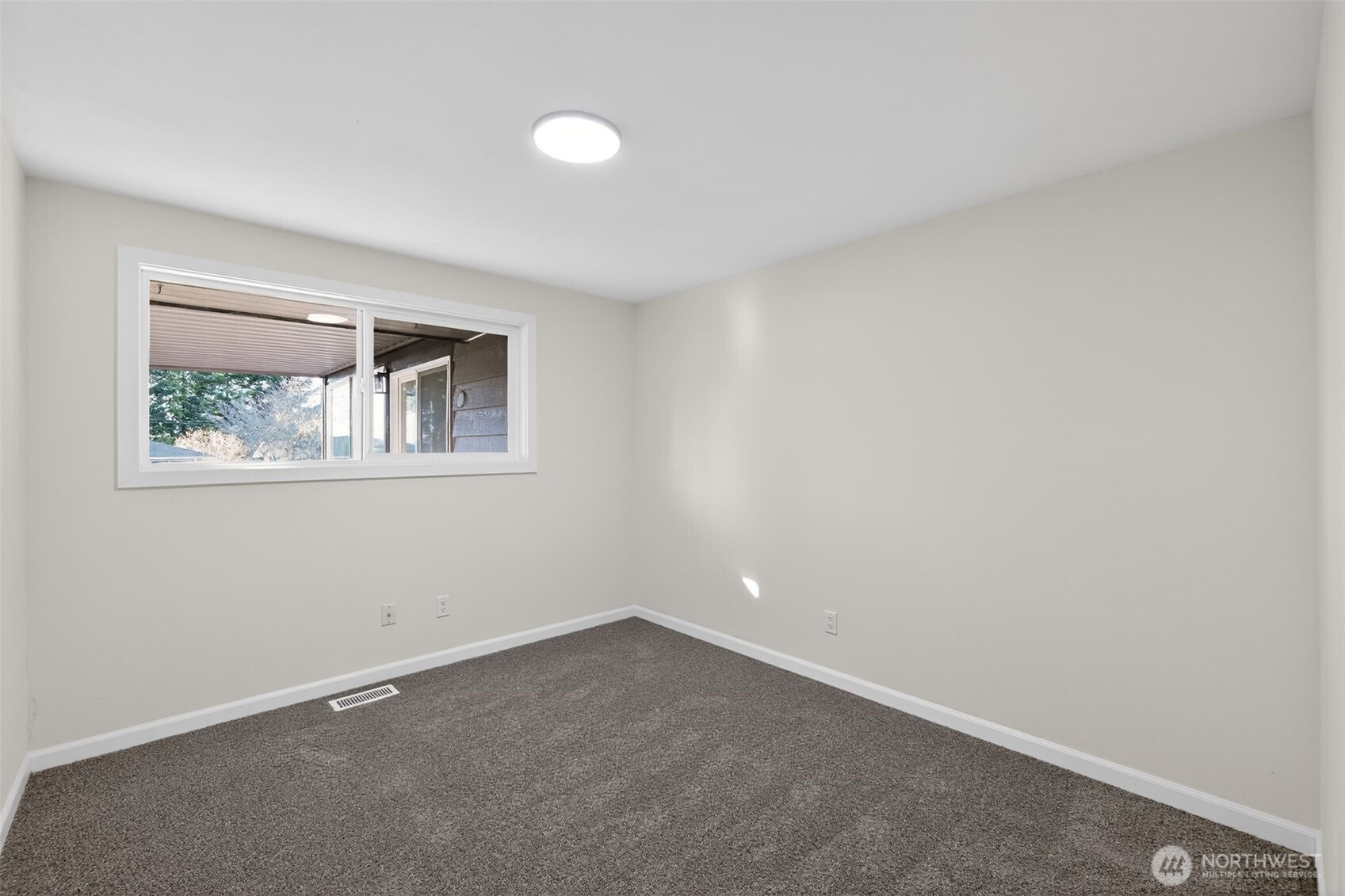 17843 110th Avenue Southeast Renton, WA 98055 - Photo 21 of 31 an empty room with a window