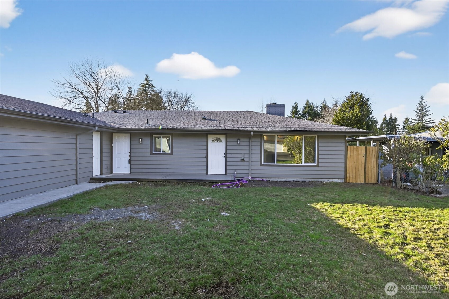 17843 110th Avenue Southeast Renton, WA 98055 - Photo 4 of 31 a view of a house with backyard and garden
