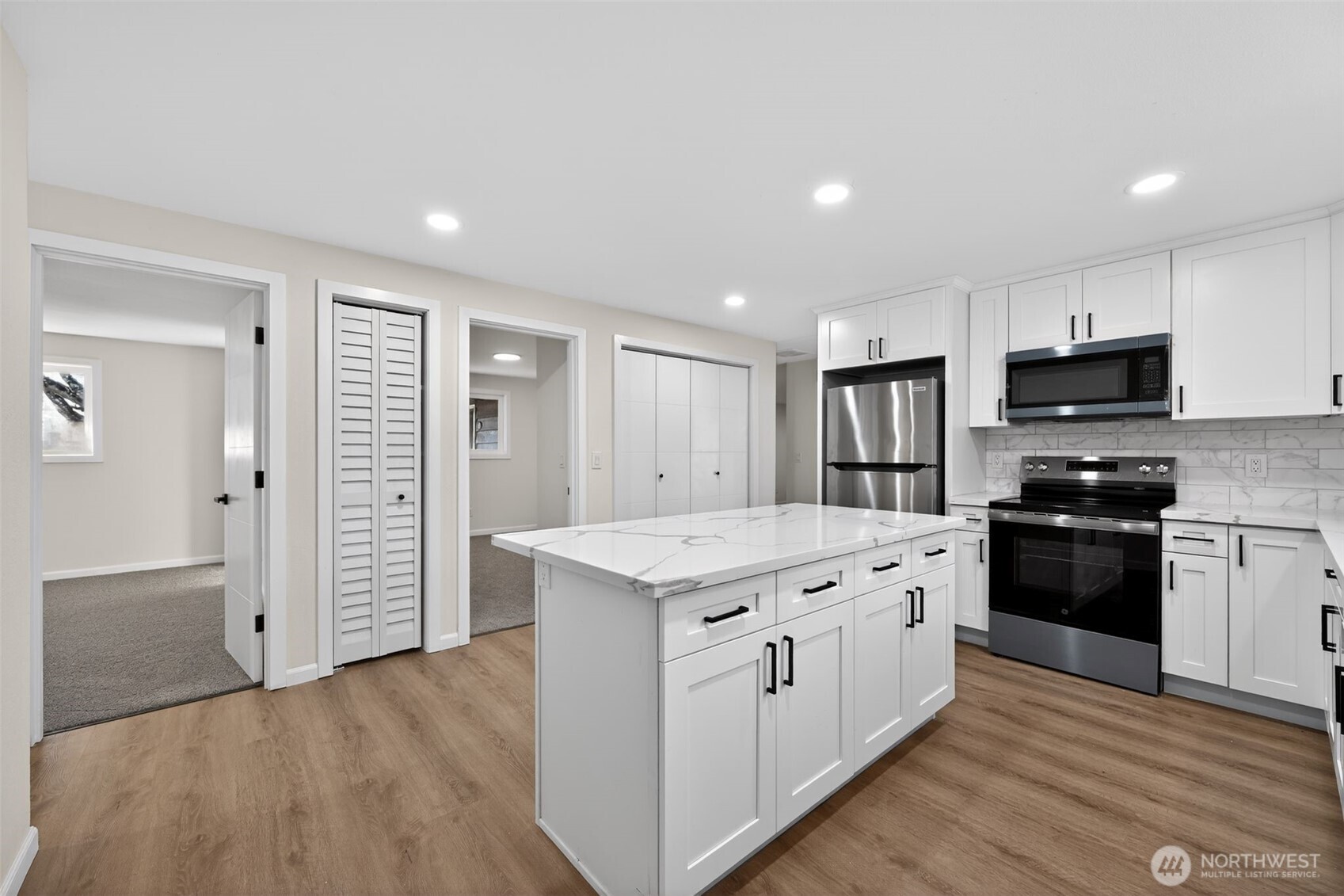 17843 110th Avenue Southeast Renton, WA 98055 - Photo 5 of 31 a kitchen with a stove a refrigerator and a sink