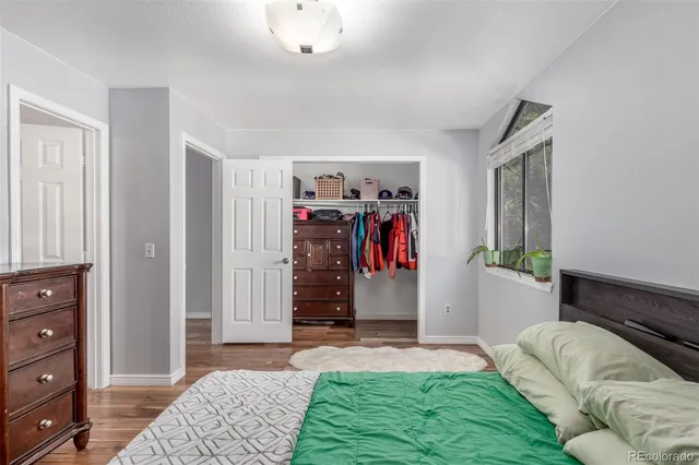 a bed room with a bed and a window