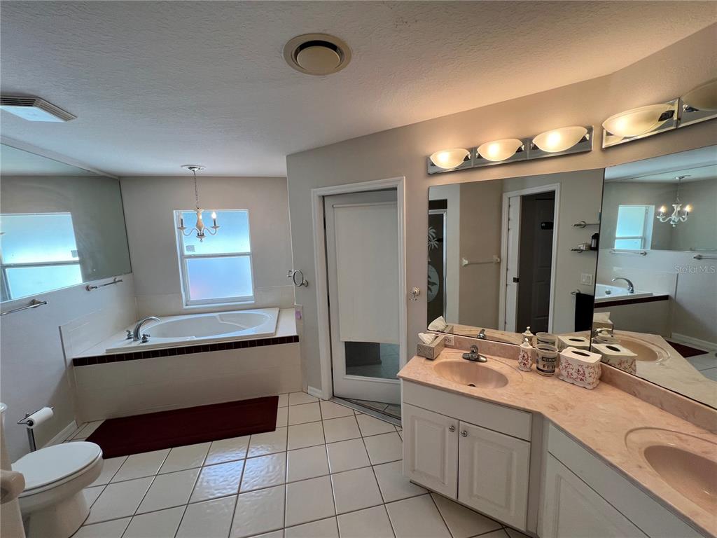 1995 East Newhaven Street Inverness, FL 34453 - Photo 26 of 48 a bathroom with a sink double vanity and a mirror