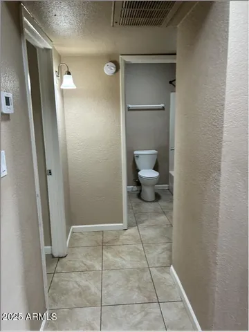 a bathroom with a sink and glass door